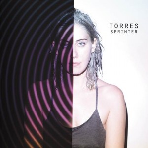Torres announces signing with Arts & Crafts records, shares her single "Strange Hellos,"